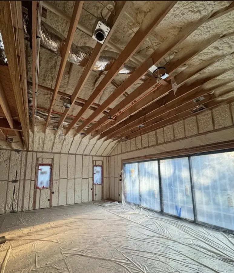 Interior walls and ceiling insulated with spray foam during new construction in Mentone